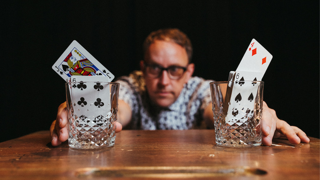 hands performing a card trick