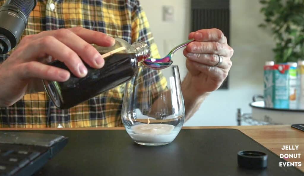 Coffee being poured on table during a latte tasting virtual event
